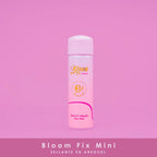 Bloom Fix Mini pink aerosol makeup setting spray bottle on pink background, cosmetic product